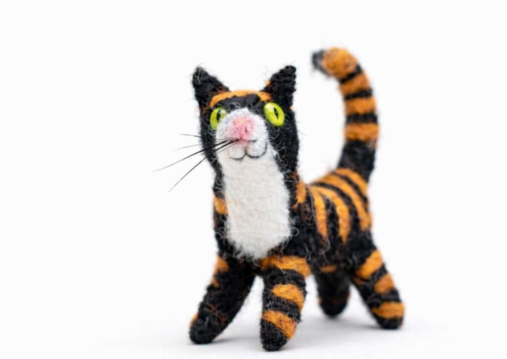 A beautiful feat and needle felted cat made by our senior artist Binita 