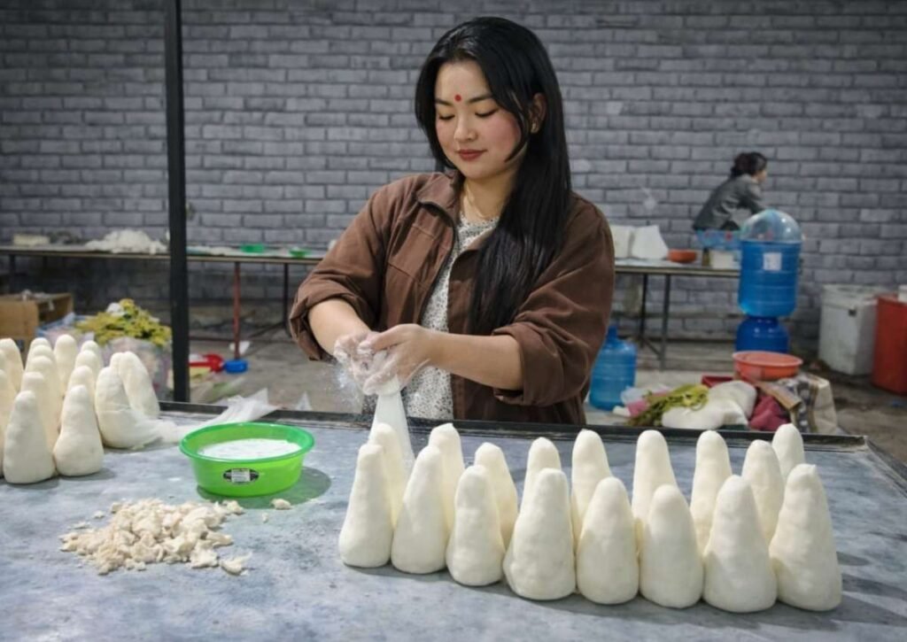 felt artist Jenisha shaping wool to art
