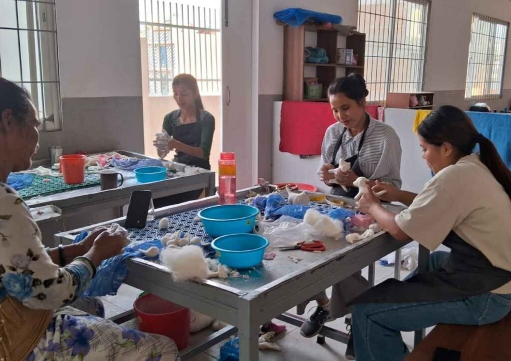 Artisans crafting custom handmade wool felt animals at Hillyarn studio in Nepal