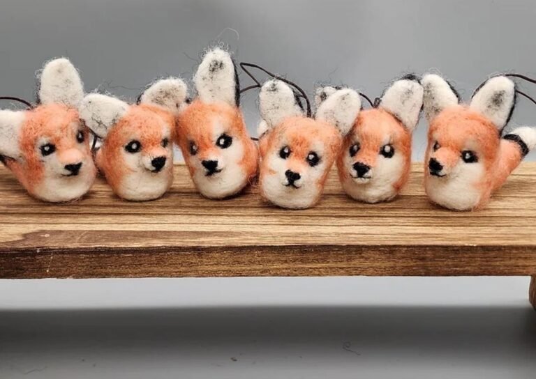 Handmade needle felted fox ornaments on wooden surface - Hillyarn custom wool design
