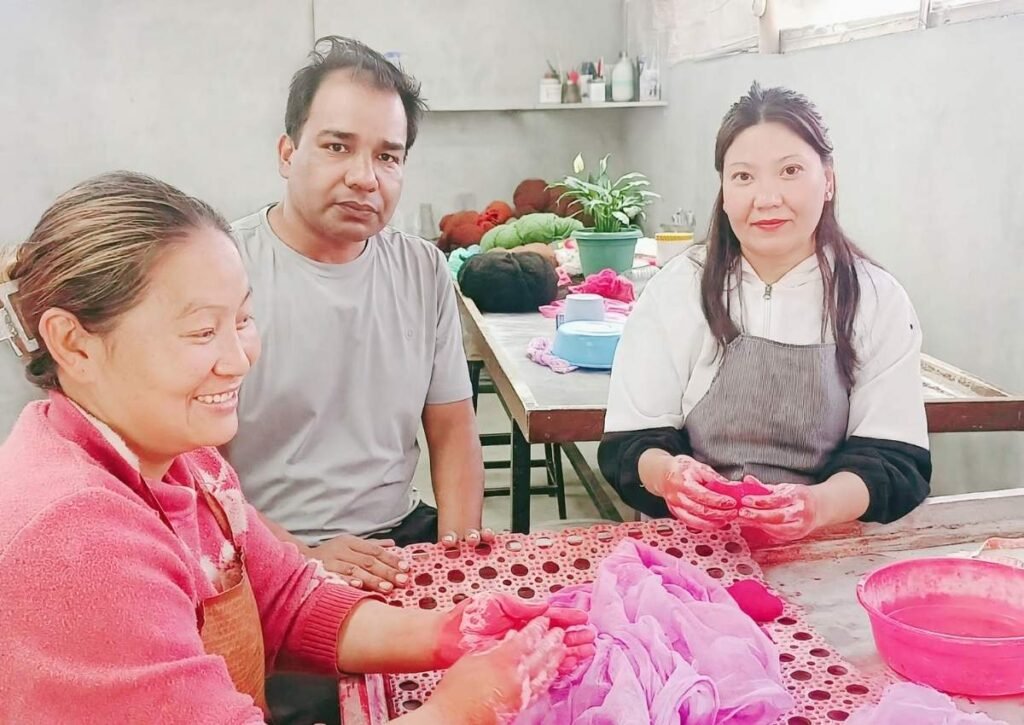 Hillyarn owner and team working together at workshop in Nepal - handmade felt products with dignity