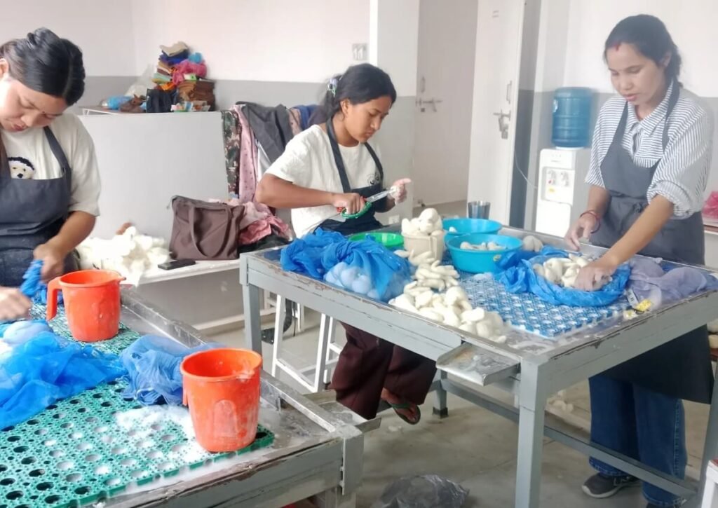 Women artisans wet felting wool at Hillyarn workshop in Nepal - handmade felt products