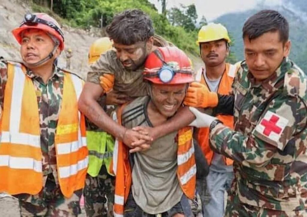 Rescue workers carrying a survivor during Rasuwa floods in Nepal 2026