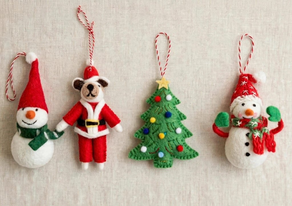 Why wholesale needle felted Christmas ornaments from Nepal are trending in 2026. This set includes 4 unique handmade designs from Hillyarn.