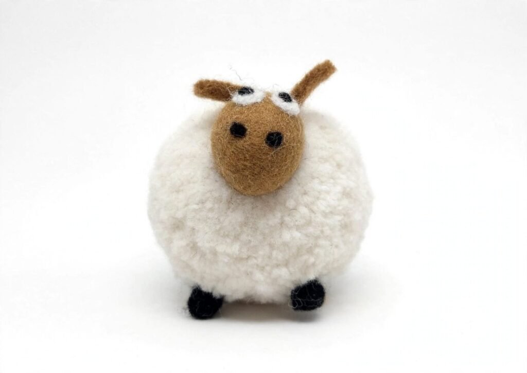 Handmade fluffy felt sheep figurine made from 100% New Zealand wool, ethically crafted by women artisans in Nepal - sustainable wool toy
